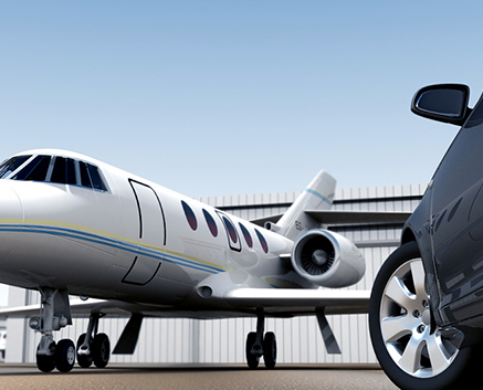 Private jet and luxury car parked side by side.