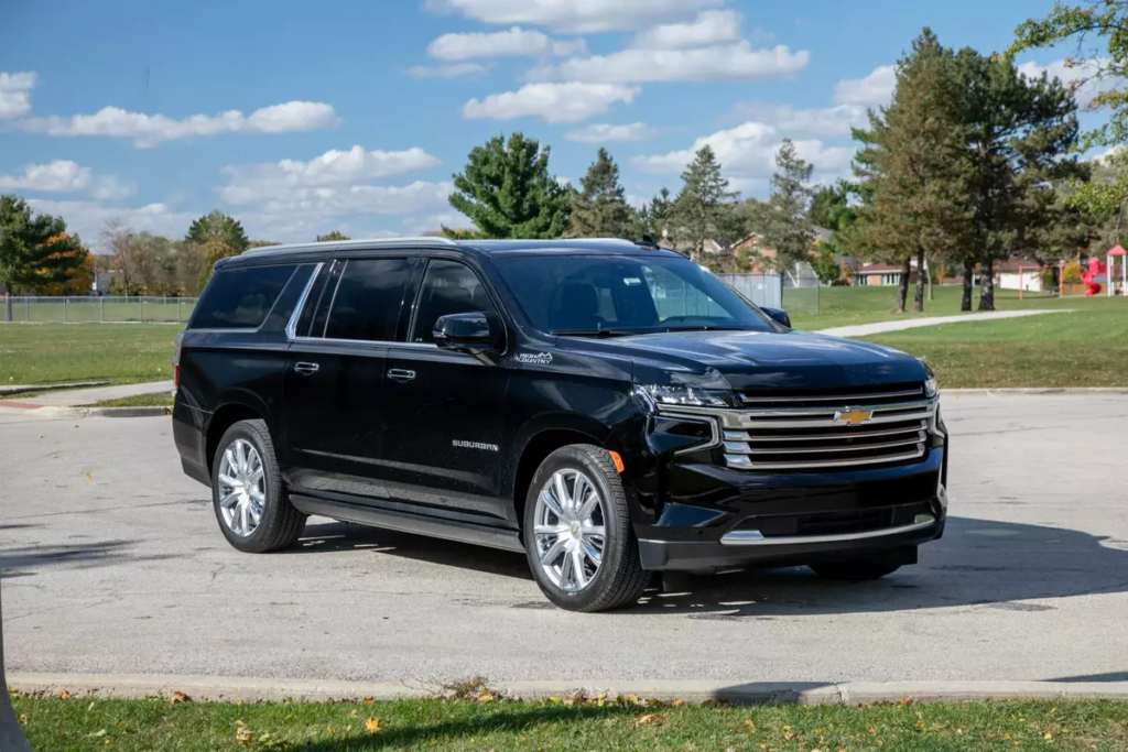 Black Chevrolet Tahoe SUV parked outdoors on a sunny day.