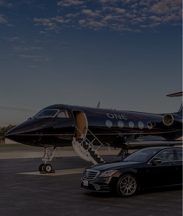 Luxury private jet and black luxury car at sunset.